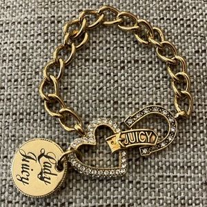 Juicy Couture vintage charm bracelet with medallion, horseshoe, heart, & clasp.